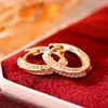 Aretes de oro con incrustaciones de diamantes simples, aretes de círculo de circonita con microincrustaciones exquisitas, aretes versátiles de lujo ligero para el viaje diario, venta al por mayor