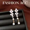 Pendientes de borla con tachuelas de perlas de aguja de plata transfronterizos, pendientes de temperamento suave y elegante, pendientes versátiles de lujo ligero y alta gama para mujer