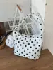 Bolso cruzado de nailon con lunares de nicho para mujer 2025 Nuevo bolso versátil de hombro y axila para salir y trabajar Bolso de mano pequeño