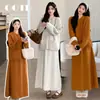 Conjunto coreano de dos piezas para el otoño de 2026, que incluye un cárdigan holgado y una falda midi fluida, diseñado para mujeres embarazadas