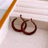 Pendientes Redondos de Rombos con Estampado de Leopardo en Tela de Aguja de Plata Pendientes Melard Retro Europeos y Americanos Pendientes de Nicho de Alta Gama Venta al por Mayor