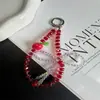Exquisita y creativa cadena de cristal para teléfono de manzana, accesorio de llavero universal de lazo de moda nicho para bolso