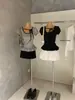 Wgwe8810 Guangzhou Shisanxing Moda Feminina Verão Novo Camiseta de Manga Curta com Bolinhas e Top com Amarração na Cintura Franzida