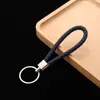 Llavero de cuerda de cuero colgante para coche accesorios cuerda de llave de cuerda de cuero tejido pu para empujar pequeño regalo fabricantes al por mayor