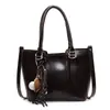 Bolso de mano retro simple brillante para axila para mujer 2025 Invierno Nuevo estilo Ropa de trabajo Versátil Bolso cruzado de hombro casual