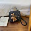 Mochila de Moda de Gama Alta con Bloques de Color para Mujer 2026 Nueva Versátil Casual Mochila de Espalda Multifuncional Pequeña para Viajes Escolares