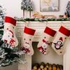 Decoraciones navideñas nuevas transfronterizas borde rojo lino de imitación estampado de dibujos animados calcetines navideños calcetines de regalo para niños colgante para árbol