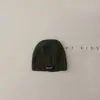 Gorro de piel de melón para bebé Estilo Primavera y Otoño Color Puro Etiqueta Pequeña Gorro de Punto Bebé de Pocos Meses Viaje de Otoño Gorro de Punto Tendencia