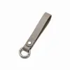 Diretamente do fabricante, chaveiro criativo em couro PU com argola de mola destacável, cordão de couro genuíno, pulseira anti-perda para chave de carro