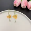 Pendientes Franceses Dulces Exquisitos con Borla Amarilla y Flor Incrustada de Diamantes Moda Diseño Elegante Sensación Elegante Lujo Ligero Accesorios para Orejas