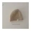 Sombrero de Cubo de Color Sólido de Diseño de Nicho Elegante Suave con Etiqueta Pequeña Gorro de Punto Cálido para Niños y Niñas