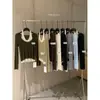 O Suéter de Malha Casual Versátil THE LIMON Estilo Chá Verde de Limão com Bloco de Cores e Gola Halter Falso Duas Peças para Mulheres no Outono