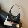 Nuevo producto de nicho: bolso de axila para mujer, nuevo modelo 2026, popular este año, nuevo bolso de hombro y cruzado tipo bollo para el día a día