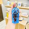 Llavero con colgante de coche de carreras para niños, modelo de coche de aleación de Superman, héroe, grafiti, con puerta trasera abierta