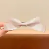 Nuevo y exquisito pasador de pelo con lazo 2026, un accesorio lujoso y de alta gama, con un diseño de pinza de plátano estilo coreano, creando un look dulce y moderno para mujeres