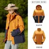 Tmall con el mismo estilo ropa de montaña impermeable a prueba de viento desmontable tres en uno para mujer otoño e invierno abrigo hombre