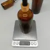 Botella de aceite esencial de 200 ml, botella de prueba de subenvasado de perfume de té, botella de envasado cosmético de 150 ml, botella de vidrio marrón