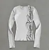 Otoño e Invierno Europeo y Americano Transfronterizo Estampado Base Y2K Moda Cuello Redondo Manga Larga Mujer Venta al por Mayor Camiseta de Moda Versátil Cruzada