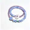Pulsera de Doble Círculo Aguamarina Fresca y Suave Estilo Chino para Mujer, Exquisita y Versátil, Apilable, con un Amuleto de Paz y Diseño de Anillo Corredizo