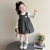 Conjunto de dos piezas de vestido tipo top sin mangas con estampado floral para niña estilo coreano, atuendo de moda nuevo para primavera y otoño 2026 para niñas pequeñas