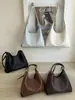 Bolsa de ombro retrô Shuai Mi Jia para mulheres 2026 nova moda trançada grande capacidade simples elegante bolsa de mão bolsa tote