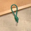 Bolsa de Corda de Couro PU Colorida Pingente Estilo Miu Simples Versátil Charme de Bolsa Chaveiro Acessório Lanyard de Celular Estilo Curto Novo