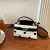 Bolso versátil de moda transfronterizo 2026 verano nuevo nicho bolsa cuadrada pequeña bolso de hombro con un toque de alta gama bolso cruzado