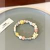 Bonita pulsera de cuentas de cerámica color crema para mujer, verano 2023, nueva pulsera de cuerda elástica para estudiantes y novias con dibujos animados.