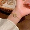 Pulsera de perlas con cuentas de venta caliente en Internet para niñas, temperamento de alta gama de lujo ligero, pulsera de piedra ojo de gato, nuevo estilo, joyería de mano al por mayor