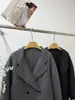 Nuevo Estilo Otoño/Invierno 2026 Abrigo de Lana para Mujer con Mangas Dobladillas y Cuello de Traje, Doble Botonadura, Corte Holgado, Engrosado y Cálido