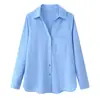Ropa de mujer transfronteriza al por mayor 2026 nueva moda casual versátil color liso con botones manga larga cuello camisero top