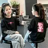 Camiseta de manga larga para niña, colección primavera/otoño 2026, elegante, algodón puro, look en capas, adecuada para niños mayores, diseño de dibujos animados, top de capa interior