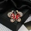 Moda europeia e americana novo broche de borboleta com diamantes de alta qualidade temperamento feminino alfinete requintado corsage da moda joia de cristal