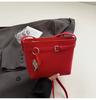 Bolsa de cubo nueva de estilo coreano para primavera y verano, nicho simple, patrón de lichi, bolsa cruzada casual para el trabajo, hebilla de cinturón distintiva, bolso para mujer