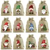 Popular juego de 12 piezas 10*14cm nuevas bolsas de regalo de Navidad, bolsas con cordón, bolsas de regalo de arpillera navideña