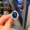 Moda europea y americana simulación tansan Anillo de diamante azul tesoro piedra principal 10*12