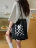 Bolsa de lunares de nicho súper popular estilo coreano para mujer 2026 Nueva bolsa versátil de un solo hombro para llevar debajo del brazo Bolsa pequeña de mano para salir a trabajar