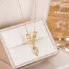 Collar de Cuentas de Transferencia de Ramas Doradas y Hojas de Jade para Mujer Cadena Dorada para Clavícula Celebración Cibernética Todo Fósforo Nuevo Diseño 2024 Colgante Personalizado