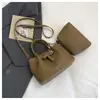 Bolsos de Mujer de Gama Alta de Nicho 2026 Nueva Primavera Versátil Retro Bolso Cruzado Estilo Coreano Bolso de Mano Más Vendido Bolso Cubo