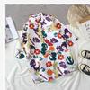 Nova Camisa Floral de Manga Curta Masculina Solta Estudante Tendência Camisa Floral Casal Jaqueta de Praia Fina Havaiana Verão