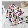 Nova Camisa Floral de Manga Curta Masculina Solta Estudante Tendência Camisa Floral Casal Jaqueta de Praia Fina Havaiana Verão