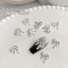 2024 Nova Chegada Luz Luxo Mini Borboleta Nail Art Acessórios Mulheres Retrô prata liga laço unha diamante decoração