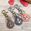 Estilo Europeo y Americano Popular Retro Literario y Artístico Unisex Aleación de Bronce Cuero Llavero Cuero Genuino Pequeño Regalo