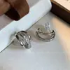 Nuevos Pendientes de Clip Metálico de Zirconia para Oreja con Bobina de Mosquito Pendientes Únicos de Estilo Europeo y Americano Simples Elegantes de Gama Alta