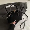 Bolso de Mano de Moda Tendencia Nicho para Mujer 2026 Modelo Nuevo Texturizado Versátil Forma de Concha Elegante para Viaje Bolso Cruzado