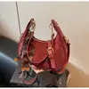Bolso de axila tipo 'dumpling' de nicho francés de alta gama transfronterizo para mujer, nuevo bolso de mano de moda, bolso de hombro versátil de estilo extranjero