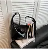 Bolso de axila retro de alta gama para mujer 2026 Nueva moda Bolso tote versátil Bolso cruzado casual de moda para mujer