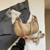 Bolsa de lua estilo coreano para mulheres, nova bolsa de mão casual de nicho da primavera de 2026, bolsa de ombro da moda, bolsa de axila para senhoras