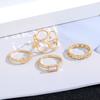 Europa y Estados Unidos transfronterizo nuevo juego de anillos geométricos para mujer retro nicho simple hueco retorcido anillo de 4 piezas al por mayor