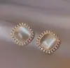 Pendientes geométricos de ojo de gato coreanos para mujer, lujosos y elegantes, con un toque de alta gama, pendientes de diamantes brillantes, estilo único y minimalista